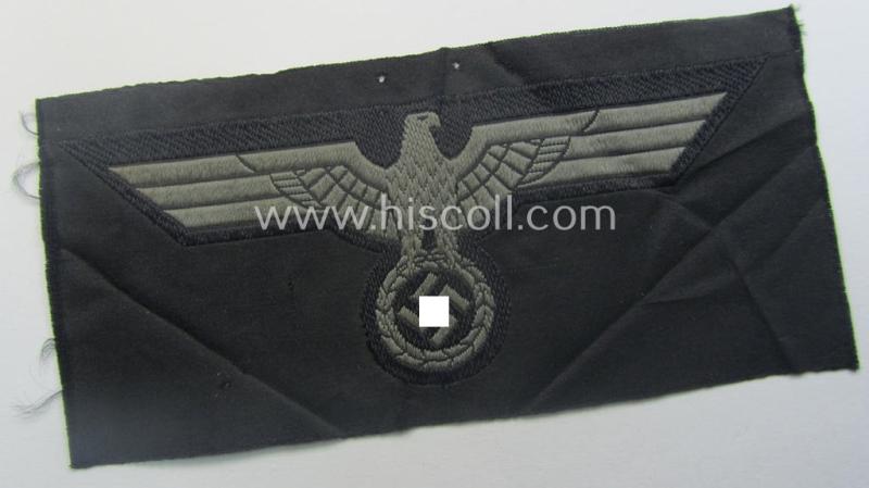 Later- (ie. mid-war-) period, WH (Heeres) 'Panzer'-type breast-eagle (ie. 'Brustadler für Panzertruppen') being a 'virtually mint- ie. unissued' example as executed in bluish-grey-coloured linnen on a black-coloured background