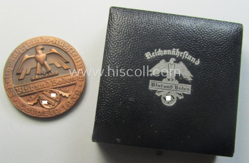 Reddish-bronze-toned, 'Reichsnährstand'- (ie. 'RNSt.'-) related, commemorative-award-plaque entitled: 'Reichsnährstands-Austellung - Blut und Boden - Leipzig 1939 - Lagerbutter' and that comes stored in its period etui