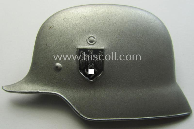 Silverish-grey-coloured- (and I deem tin-based) WH (Heeres) related so-called: 'photo-album-device' depicting a German steel-helmet (with attacched decal!) and being a non-maker-marked example