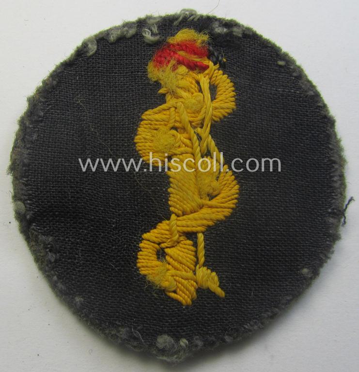 Clearly used- and/or tunic-removed WH (Heeres) so-called: trade- and/or special-career arm-insignia as was intended for a: 'Sanitäter' being a neatly hand-embroidered specimen on a field-grey-coloured background