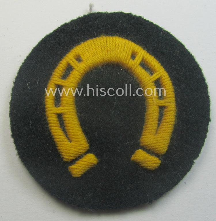 WH (Heeres) so-called: trade- and/or special-career arm-insignia (ie. 'Laufbahn- o. Tätigkeitsabzeichen') as was specifically intended for an army: 'Hufbeschlagmeister' (or farrier) being a neatly hand-embroidered variant on darker-green-coloured wool