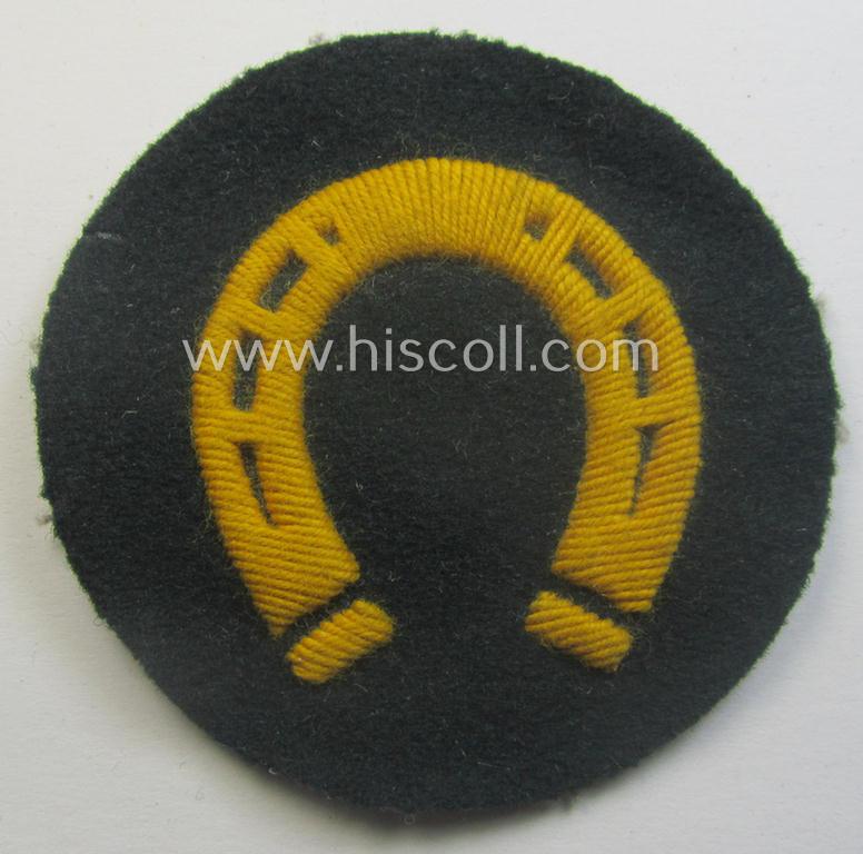 WH (Heeres) so-called: trade- and/or special-career arm-insignia (ie. 'Laufbahn- o. Tätigkeitsabzeichen') as was specifically intended for an army: 'Hufbeschlagmeister' (or farrier) being a neatly hand-embroidered variant on darker-green-coloured wool