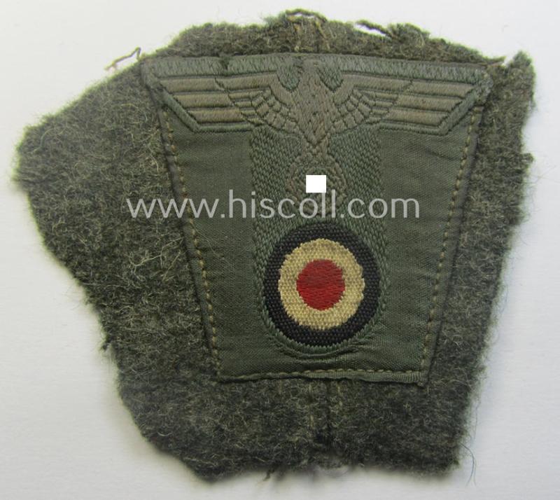 WH (Heeres) so-called: 'T-shaped'- (ie. 'M42-pattern') cap-eagle/cocarde (ie. cap-trapezoid) as executed in 'BeVo'-weave pattern that comes still mounted onto its 'cut-out' cap front-piece