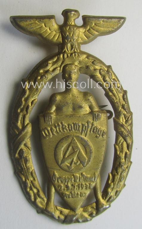 Zinc-based- and bright-golden-toned, SA- (ie. 'Sturmabteilungen'-) related day-badge (ie. 'tinnie') as was issued to commemorate an: 'SA'-gathering ie. rally entitled: 'Wettkampftage - SA-Gruppe Westmark - 2.3.7.1938 - 12. Juni 1938 - Koblenz'
