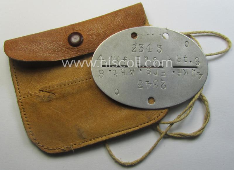 Aluminium-based, WH (Heeres-) transport (ie. 'Nachshub'-) related ID-disc, bearing the clearly stamped unit-designation: '4./Kf.Ers.Abt. 6' and that comes stored in its period- (and personalised!) pouch as issued and/or worn