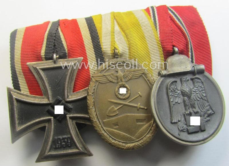 3-pieced, WWII-period medal-bar (ie. 'Ordenspange') showing resp. an: 'EKII.Kl.', a: 'Westwall'-medal and a: 'Medaille Winterschlacht im Osten 1941-42'