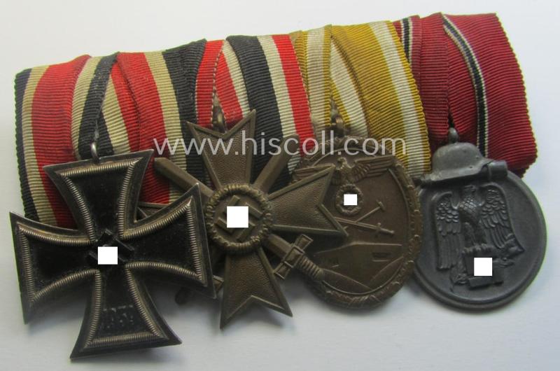 4-pieced, WWII-period medal-bar (ie. 'Ordenspange') showing resp. an: 'EKII.Kl.', a: 'KvKII.Kl. m. Schw.', a: 'Westwall'-medal and a: 'Medaille Winterschlacht im Osten 1941-42'