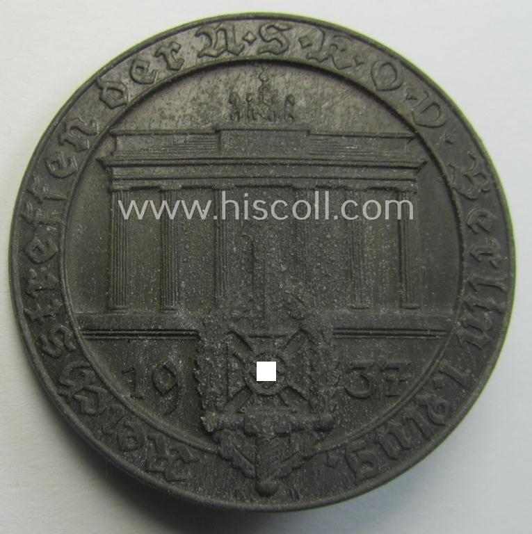 Commemorative, greyish-black-toned- and/or: typical zinc-based: 'N.S.K.O.V.'-related 'tinnie' being a maker- (ie. 'A. Donner'-) marked example showing the text: 'Reichstreffen der N.S.K.O.V. - Berlin - 1. Aug. 1937'