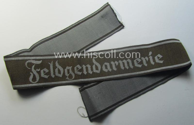 Hardly ie. never worn example of a WH (Heeres) cuff-title ie. armband (ie. 'Ärmelstreifen') entitled: 'Feldgendarmerie' (being a typical 'BeVo'-woven example)