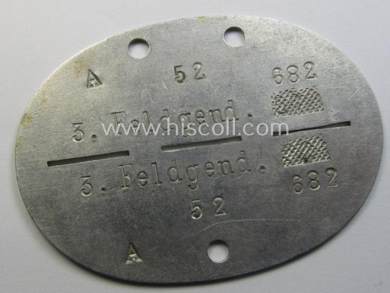 Aluminium-based, WH (Heeres-) ie. 'Feldgendarmerie'-related ID-disc (ie. 'Erkennungsmarke') bearing the clearly stamped unit-designation that simply reads: '3. Feldgend. 682' and that comes as issued and found