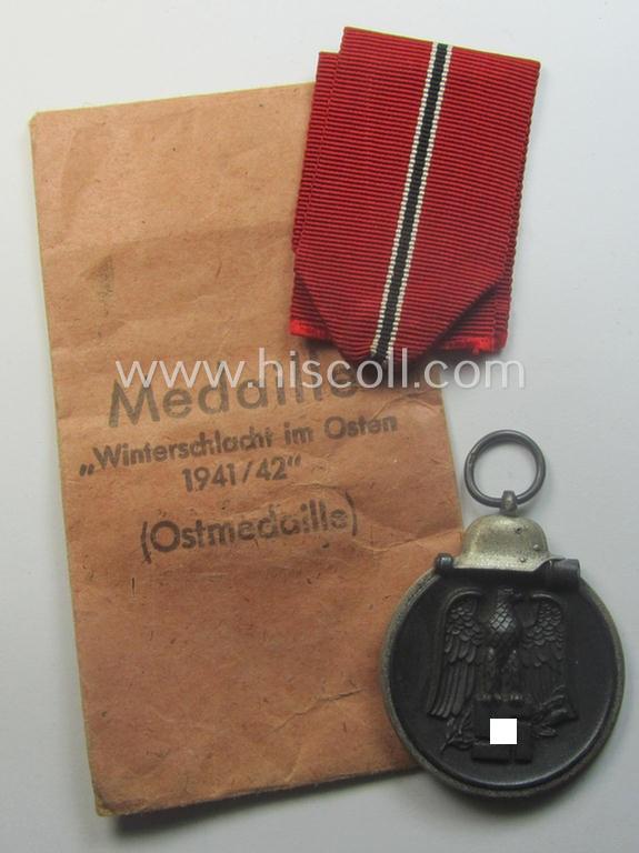 Medal-set: 'Winterschlacht im Osten 1941/42' as produced by the: 'Deschler u. Sohn'-company being a clearly maker- ie. '1'-marked specimen that came stored in its original 'Zellstoff'-based pouch of issue as found