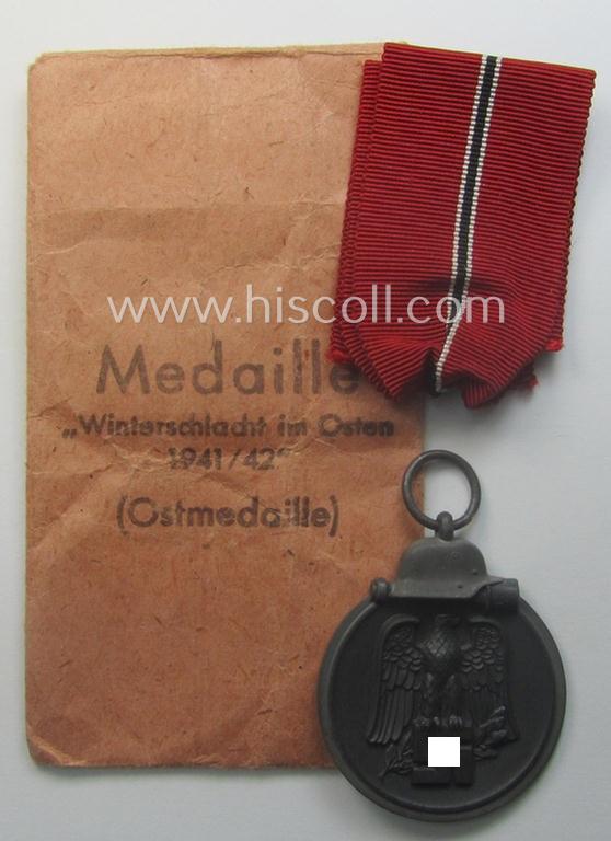 Medal-set: 'Winterschlacht im Osten 1941/42' as produced by the: 'Förster & Barth'-company being a clearly maker- (ie. '10'-marked) specimen that came stored in its original 'Zellstoff'-based pouch of issue as found