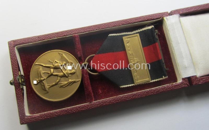WH Czech-occupation- (ie. 'Anschluss'-) medal: '1. Oktober 1938' that comes with its period-attached 'PB-Spange' and that comes stored in its bordeaux-red-coloured- and/or non-maker-marked etui