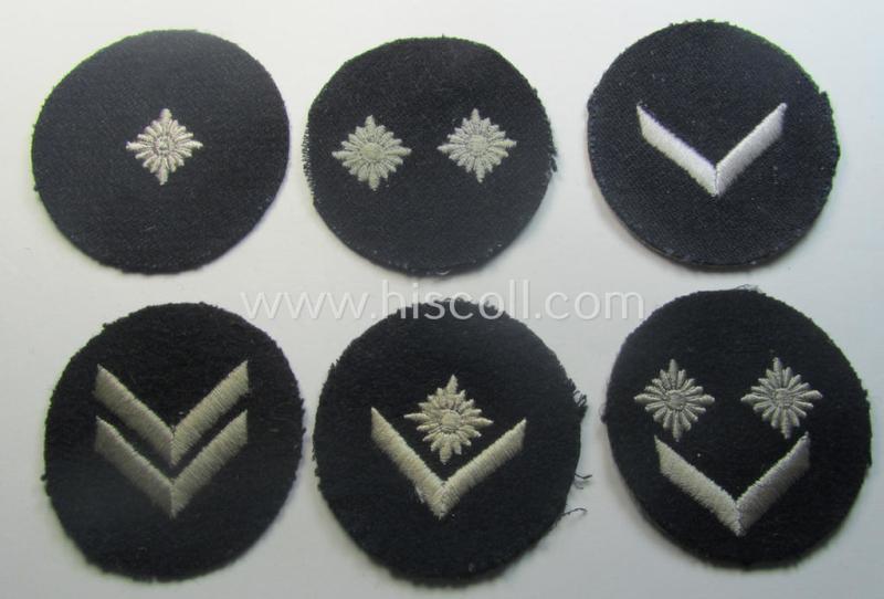 Interesting - and hardly ie. even never used! - 6-pieced (and almost complete), DJ- (ie. 'Deutsches Jungvolk in der HJ') insignia-set comprising of 6 darker-blue-toned rank-patches (ie. 'Rangzeichen') of which one still holds its period 'RzM'-etiket