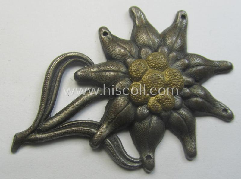 WH (Heeres) (darkened) silverish- (ie. golden-) coloured, zinc-based (and neatly maker- ie. 'F&B'-marked) so-called: 'M43'-pattern 'Edelweiss'-cap-badge (ie. 'Mützenabzeichen')