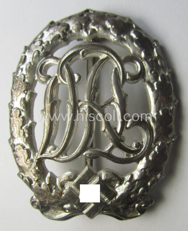 'Virtually mint' example of a: 'Reichssportabzeichen DRL in Silber' (or: DRL sports'-badge in silver) being a just moderately worn- ie. used example that is nicely maker- (ie. 'Wernstein - Jena'-) marked on its back