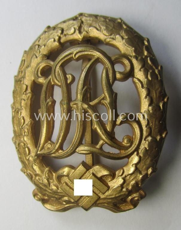 'Virtually mint' - and truly rarely found! - example of a: 'Reichssportabzeichen DRL in Gold' (or: DRL sports'-badge in gold) being a just moderately worn- ie. used example that is nicely maker- (ie. 'Wernstein - Jena'-) marked on its back