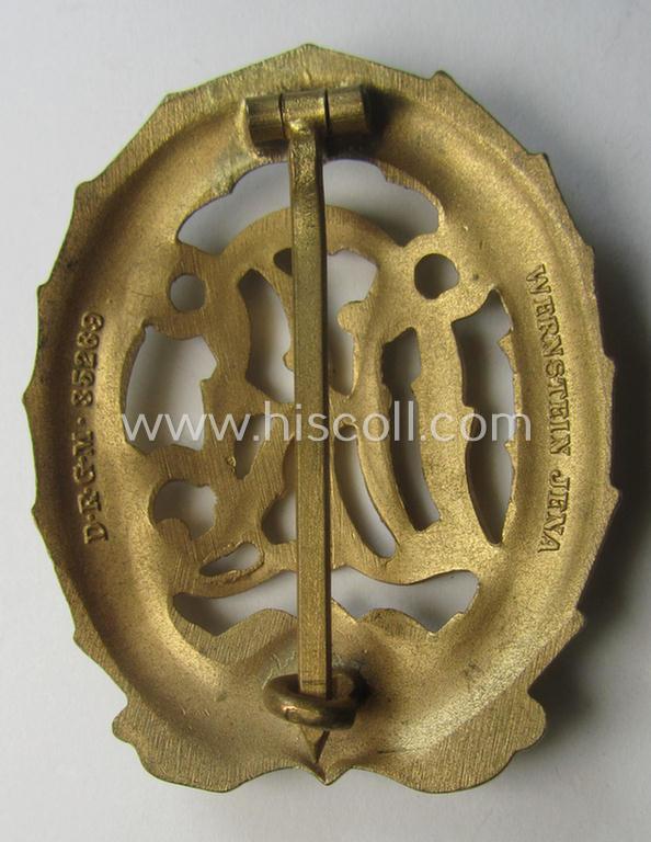 'Virtually mint' - and truly rarely found! - example of a: 'Reichssportabzeichen DRL in Gold' (or: DRL sports'-badge in gold) being a just moderately worn- ie. used example that is nicely maker- (ie. 'Wernstein - Jena'-) marked on its back