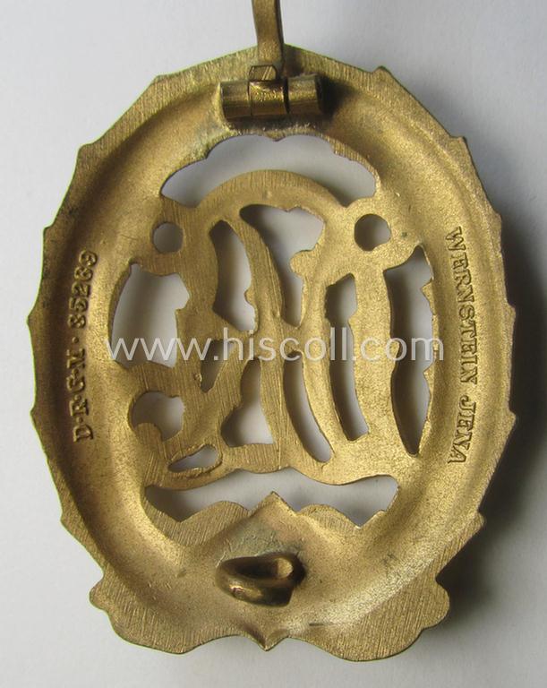 'Virtually mint' - and truly rarely found! - example of a: 'Reichssportabzeichen DRL in Gold' (or: DRL sports'-badge in gold) being a just moderately worn- ie. used example that is nicely maker- (ie. 'Wernstein - Jena'-) marked on its back