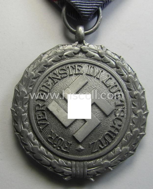 'Stonemint', light-weight (ie. typical aluminium-based) medal as was intended for air-raid wardens 2nd. class (or: 'Luftschutz-Ehrenzeichen 2. Stufe') that comes stored in its period, dove-grey-coloured etui