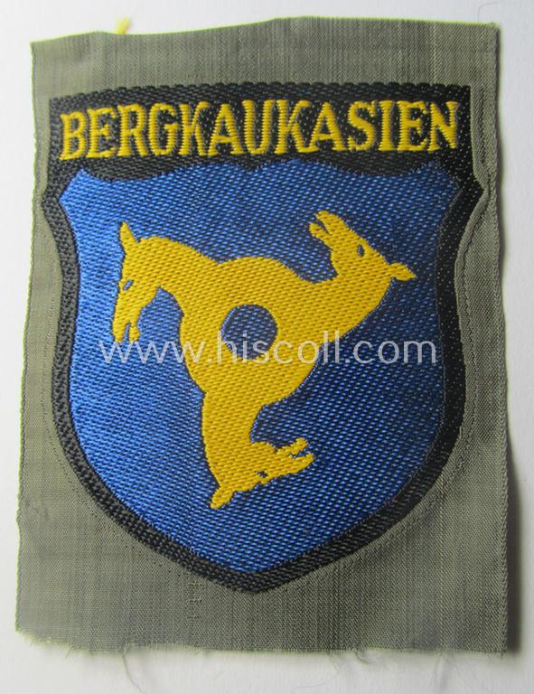 'BeVo'-type armshield (of the second pattern!) entitled: 'Bergkaukasien', being a piece as intended for a volunteer who served within the 'Deutsche Wehrmacht' ie. within the 'Berg- o. Nord-Kaukasisches Legion'