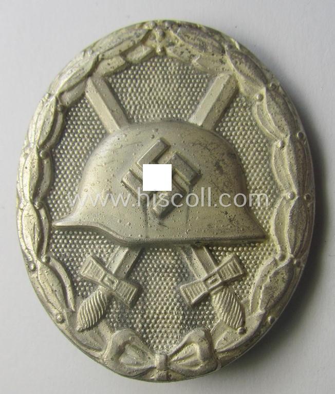 Minimally used- ie. worn, 'Verwundeten-Abzeichen in Silber' (or: silver-class wound-badge) being a neatly (dual!) maker- (ie. '100'- and/or: 'L55'- ) marked example as was produced by the: 'Rudolf Wächtler u. Lange'-company