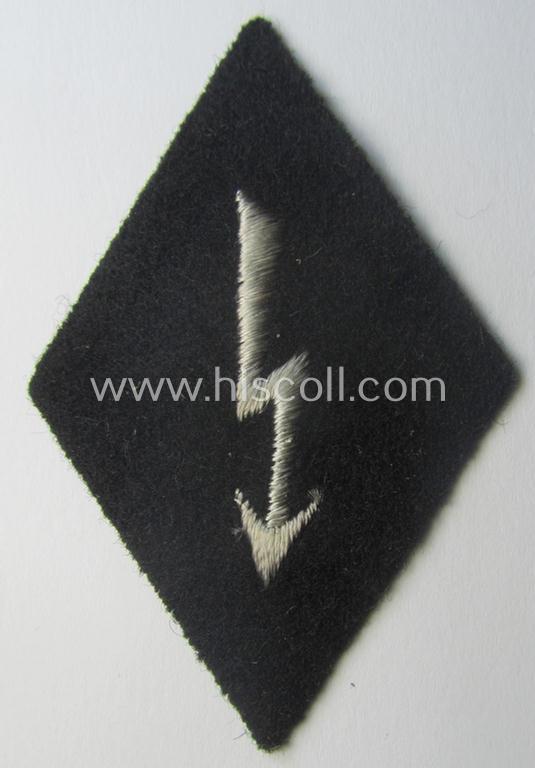 Waffen-SS-pattern, machine-embroidered and black-coloured sleeve-insignia (ie. 'Ärmelraute') depicting a: 'Signalblitz' ('SS-Nachrichten-Trpn.')