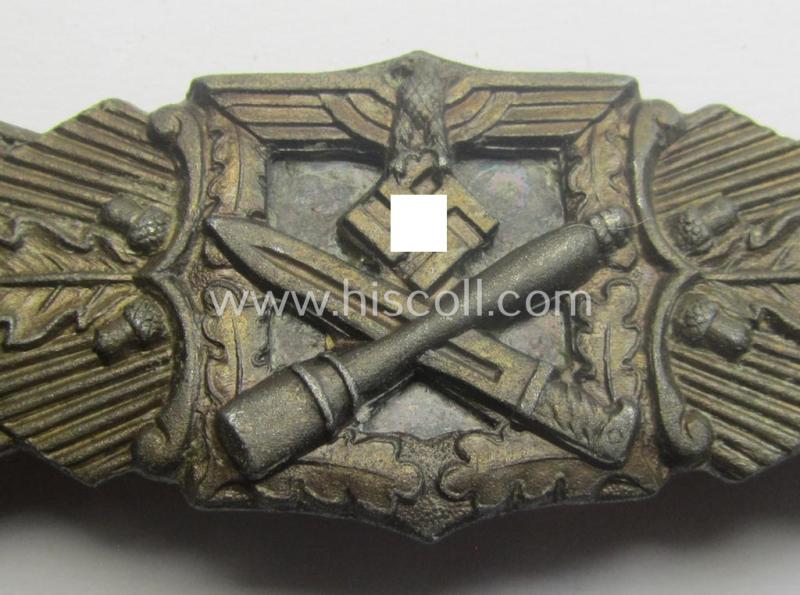 'Nahkampfspange in Bronze' (or: bronze-class close-combat clasp ie. CCC) being a neatly maker-marked- and/or minimally converse-shaped specimen by the maker- (ie. 'Hersteller') 'C.E. Juncker - Berlin'