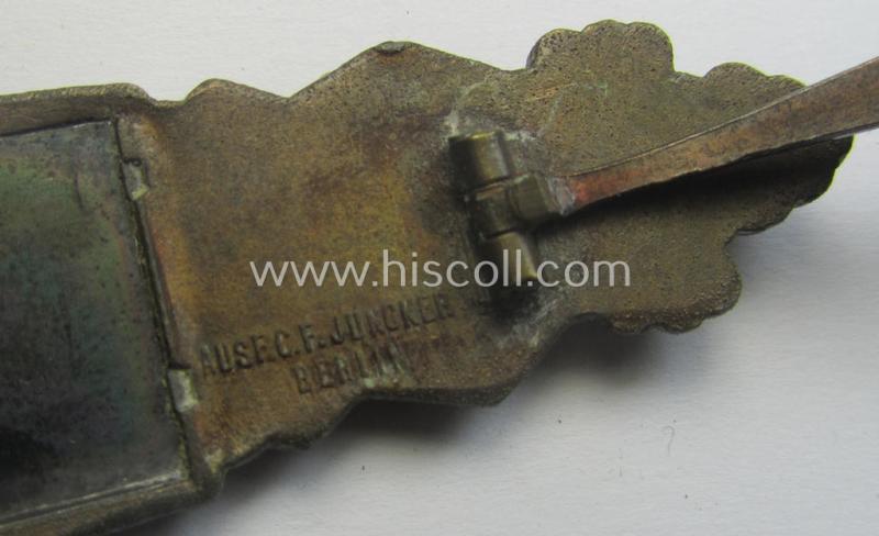 'Nahkampfspange in Bronze' (or: bronze-class close-combat clasp ie. CCC) being a neatly maker-marked- and/or minimally converse-shaped specimen by the maker- (ie. 'Hersteller') 'C.E. Juncker - Berlin'