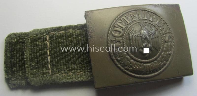 WH (Heeres) 'tropical-issued' belt-buckle being a non-maker-marked, field-grey-coloured example that comes mounted onto its original, greenish-coloured- (and/or: 'webbing'-based-) tab