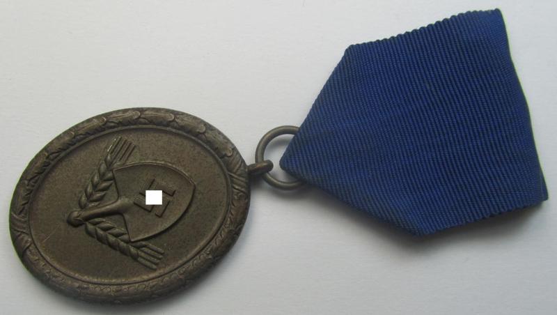 RAD (ie. 'Reichsarbeitsdienst'): 'Dienstauszeichnung 4. Stufe für Männer' as was intended for 4 years loyal-service and that comes mounted onto its period (broad-sized) ribbon (ie. 'Bandabschnitt')