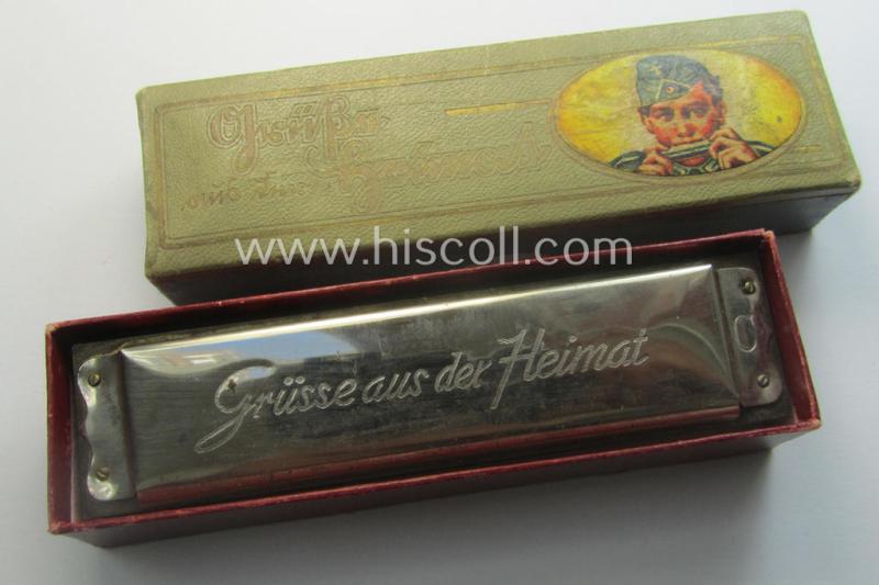 TR-era- (ie. 'Deutsche Wehrmacht'-) related harmonica entitled: 'Grüsse aus der Heimat' that came stored in its original and/or carton-based box ie. etui