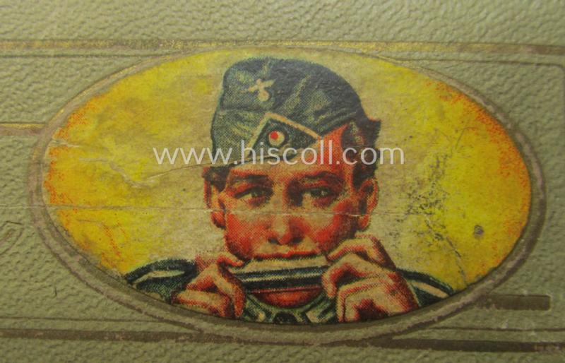 TR-era- (ie. 'Deutsche Wehrmacht'-) related harmonica entitled: 'Grüsse aus der Heimat' that came stored in its original and/or carton-based box ie. etui