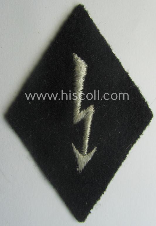 Waffen-SS-pattern, machine-embroidered and black-coloured sleeve-insignia (ie. 'Ärmelraute') depicting a: 'Signalblitz' ('SS-Nachrichten-Trpn.')