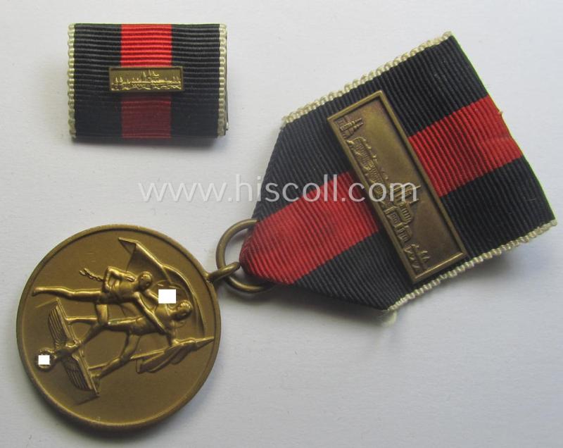WH Czech-occupation- (ie. 'Anschluss'-) medal: '1. Oktober 1938' that comes mounted onto its period ribbon and that shows a firmly (and period!) attached 'Prager Burg-Spange' and that came with its accompanying 'Feld-/Bandspange'