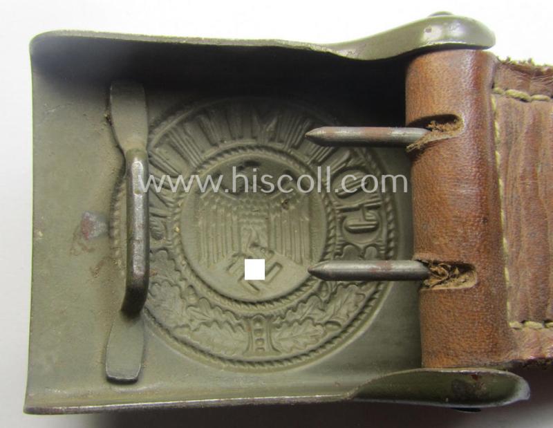 Minimally used, WH (Heeres) field-grey-coloured- and/or steel-based belt-buckle being a (typical) non-maker-marked example that comes mounted onto its maker- (ie. 'C.W. Motz'-) marked and/or '1941'-dated leather-based tab