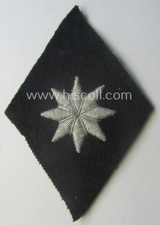 Waffen-SS, officers'-pattern, hand-embroidered sleeve-insignia (ie. 'Ärmelraute') for an: 'SS-Führer im Verwaltungsdienst' still retaining its period 'RzM'-etiket