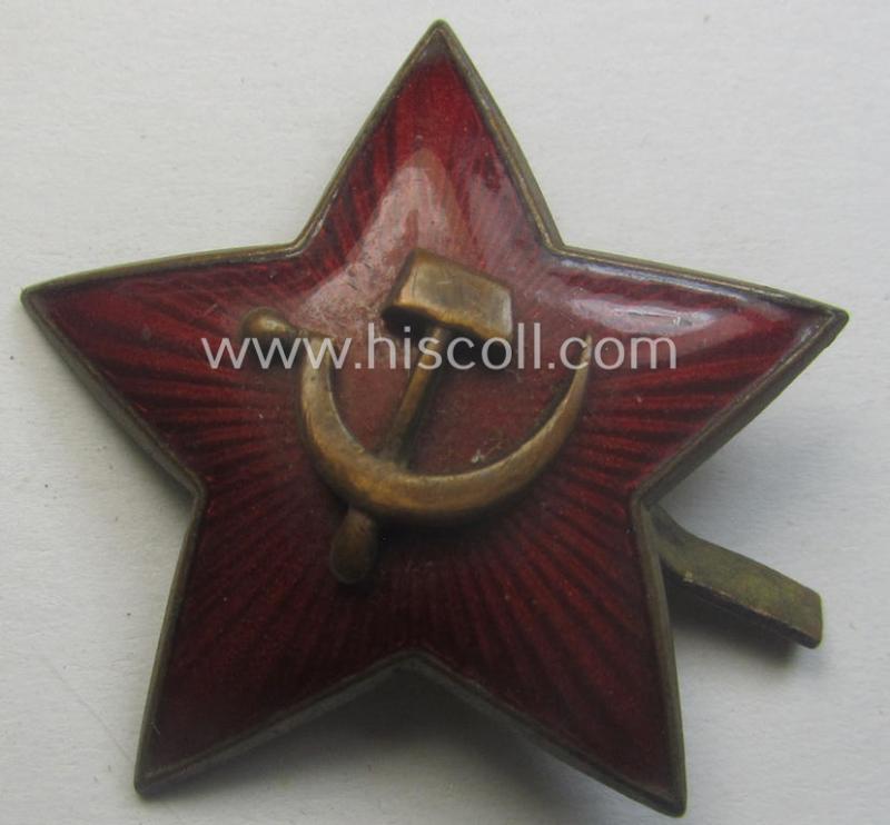 Unusal item that originated from a German soldier: a Russian, larger-sized and/or WWII-period, enamelled star-shaped cap-badge showing the communist logo on a bright-red-coloured surface