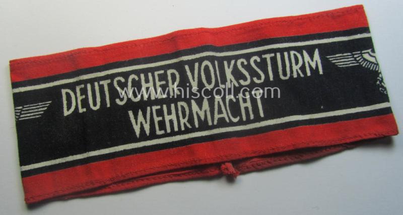 Typically printed- and/or later-war-period, bright-red- and/or black-coloured so-called: 'Deutscher Volkssturm'-armband (ie. 'Armbinde') that comes in an overall very nice- (I deem hardly used- nor worn- ie. 'virtually mint'-), condition