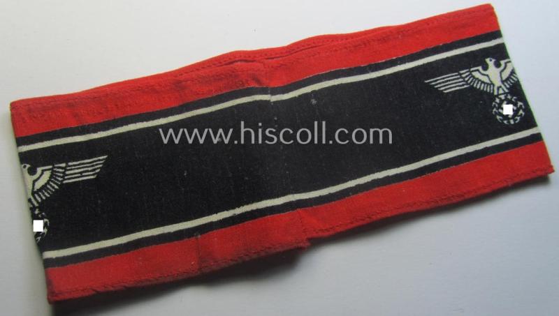 Typically printed- and/or later-war-period, bright-red- and/or black-coloured so-called: 'Deutscher Volkssturm'-armband (ie. 'Armbinde') that comes in an overall very nice- (I deem hardly used- nor worn- ie. 'virtually mint'-), condition