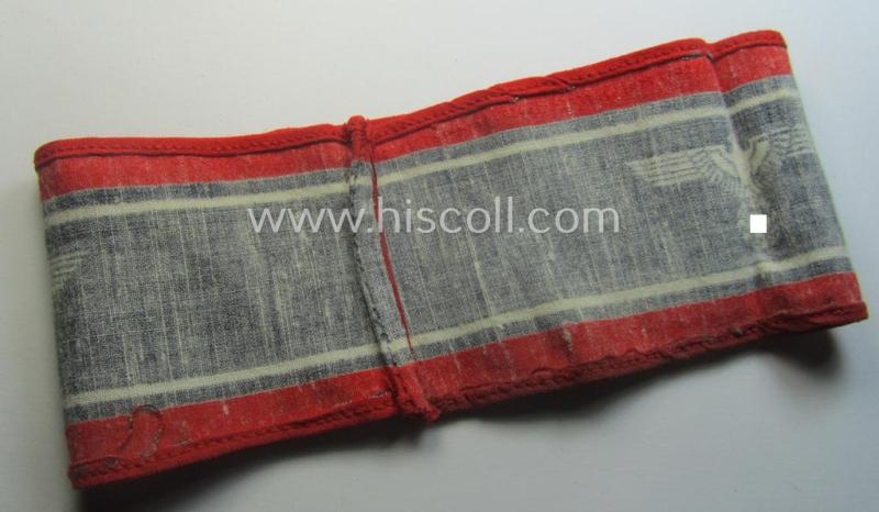 Typically printed- and/or later-war-period, bright-red- and/or black-coloured so-called: 'Deutscher Volkssturm'-armband (ie. 'Armbinde') that comes in an overall very nice- (I deem hardly used- nor worn- ie. 'virtually mint'-), condition