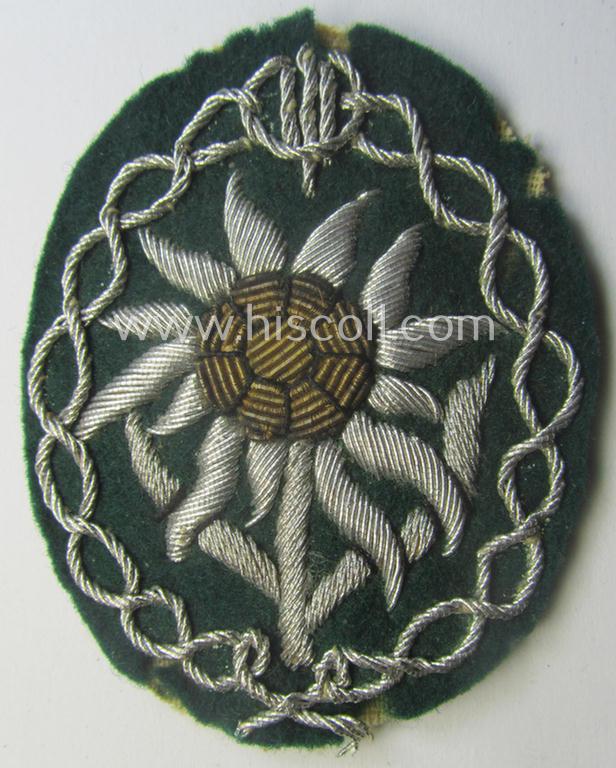 Moderately used, WH (Heeres) neatly hand-embroidered- and/or typical officers'- (ie. 'variant'-) pattern so-called: 'Edelweiss'-arm-badge (as specifically intended for usage by an officer serving within the 'Geb.-Jäger-Trpn.'