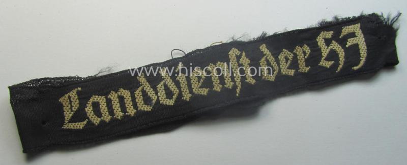 Truly worn (ie. relic) example) of the - actually scarcely encountered! - HJ ('Hitlerjugend') armband (ie. cuff-title) as woven in the neat 'BeVo'-like-pattern, entitled: 'Landdienst der HJ'