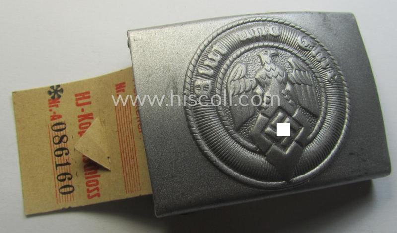 'Virtually mint' - and actually very scarcely encountered! - 'HJ- o. Hitlerjugend'-belt-buckle being a clearly maker- (ie. 'RzM M4/24'- ie. 'FLL') marked example that comes with its period-attached makers'-etiket
