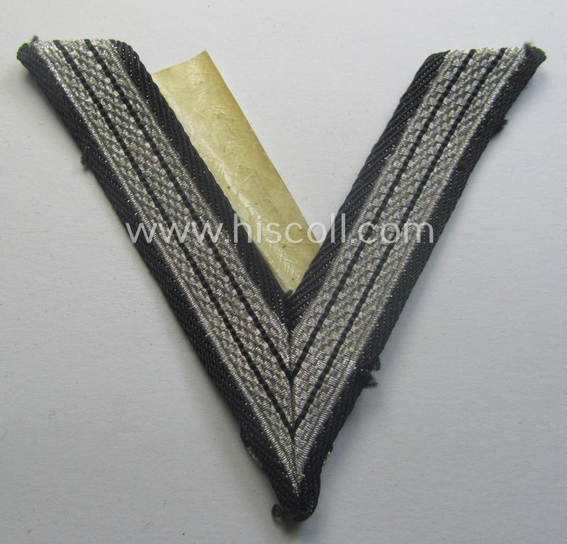 SS (ie. 'Allgemeine o. Waffen-SS') arm-insignia being an 'SS', so-called: 'Ehrenwinkel für Altgediente Kämpfer o. Angehörigen der SS' (or: honorary-chevron for old campaigners) still retaining its period 'RzM'-etiket