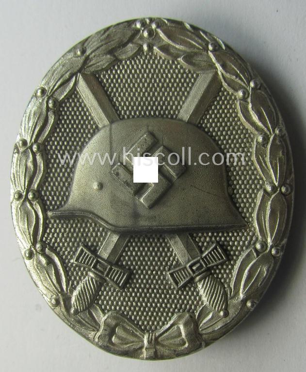 Silver-class wound-badge (or: 'Verwundeten-Abzeichen in Silber') being a maker- (ie. '65'-) marked example as was produced by the 'Hersteller' ie. maker: 'Klein u. Quenzer'