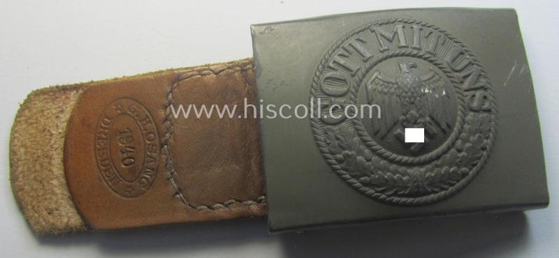 'Virtually mint', 'standard-issue'-pattern, WH (Heeres) field-grey-toned- and steel-based belt-buckle being a non-maker-marked example that comes mounted onto its 'G.H. Osang'-marked and/or '1940'-dated tab