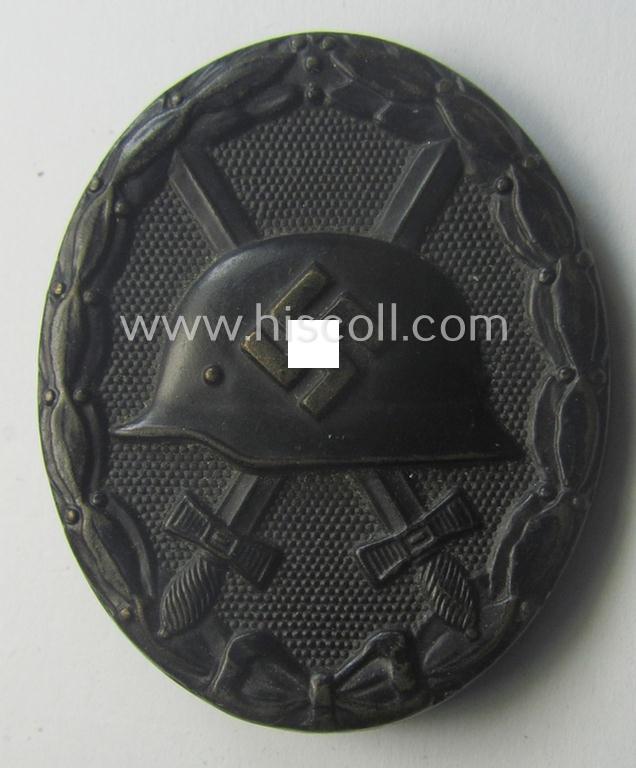 Clearly maker- (ie. 'L/11'-) marked example of a black-class wound-badge (or: 'Verwundeten-Abzeichen in Schwarz') being an example that was produced by the maker (ie. 'Hersteller') named: 'Wilhelm Deumer'