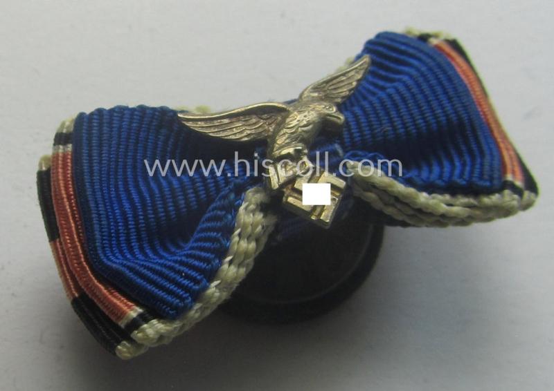 Interesting, 3-pieced WH (Luftwaffe) related ribbon-bar (ie. 'Feld- o. Bandspange') showing a: 'WH-DA 4. Stf.' and an Austrian- and/or Czech 'Anschluss'-medal and that comes mounted onto its specific 'button-hole'-set-up