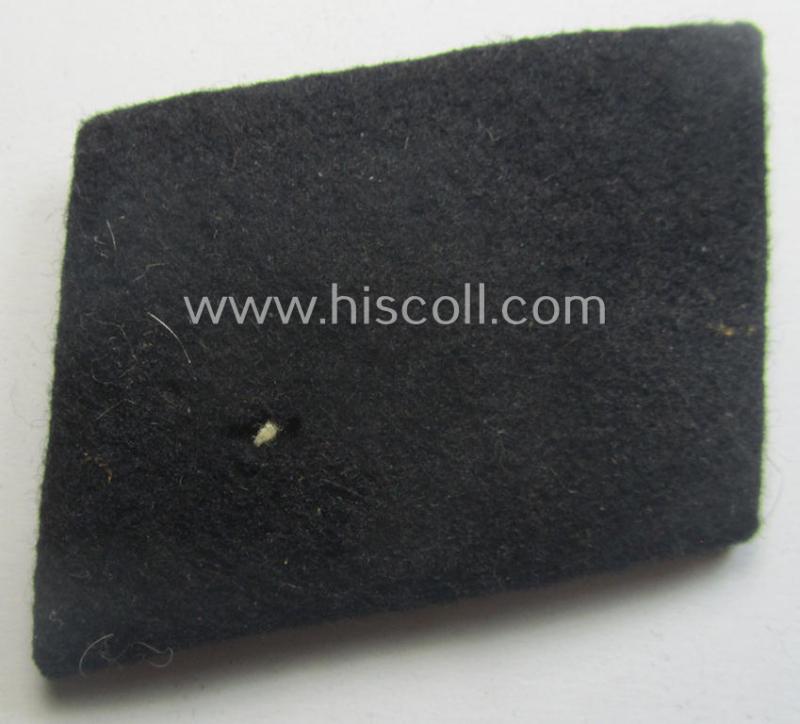 Waffen-SS EM-pattern rank-collar-rank-tab ('Kragenspiegel') being a 'standard-issue'-pattern example as executed in black-coloured wool as was intended for usage by an: 'SS-Mann'